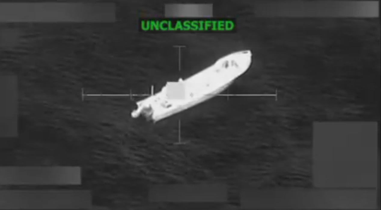 black and white image of target over a white-colored boat. green text at top says "unclassified"